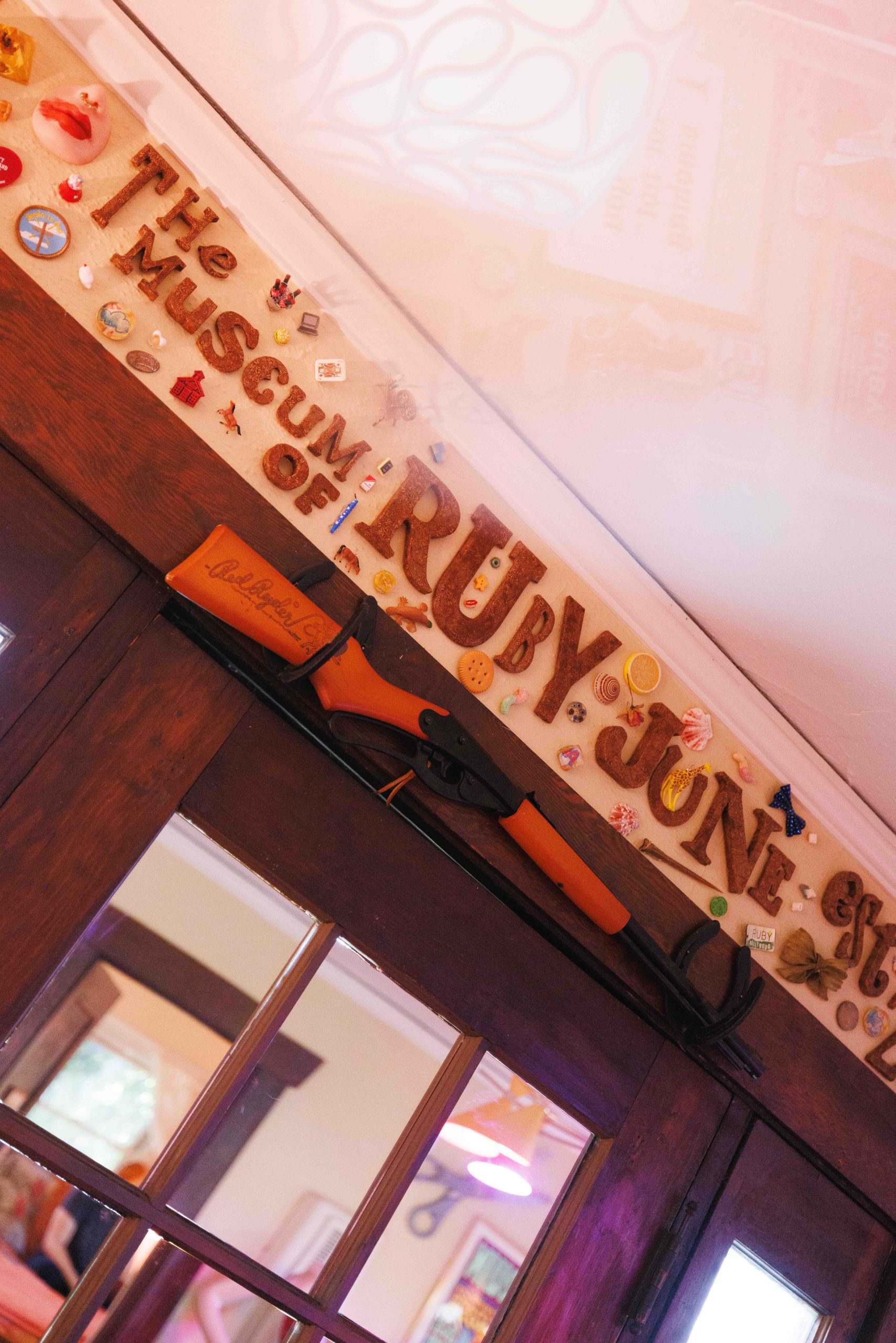 A handmade Museum of Ruby June sign hangs above the entrance.